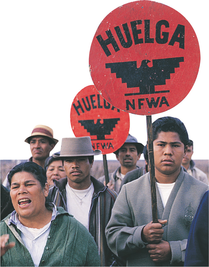 Photo: Farm workers march carrying protest signs.