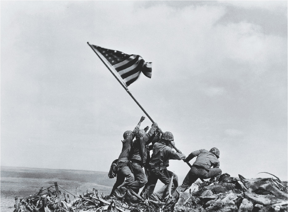 Photo: 5 Marines raise a U.S. flag.