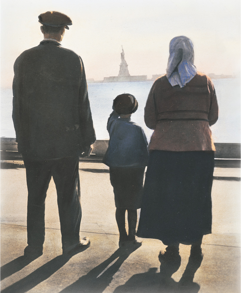 A family gazes at the Statue of Liberty.