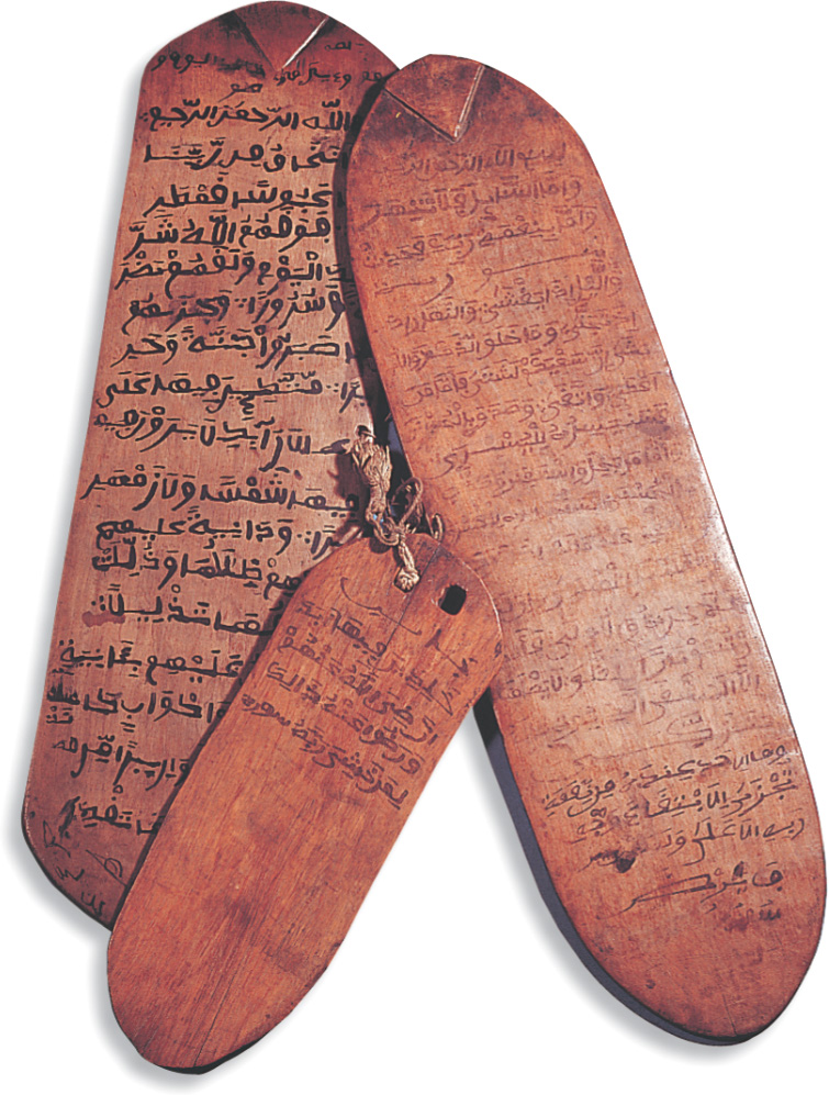 Small wooden boards with carved writing.