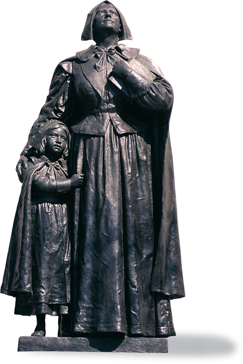 a statue: a woman holding a book puts her arm around a small child.