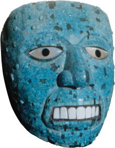 A native mask with bared teeth.