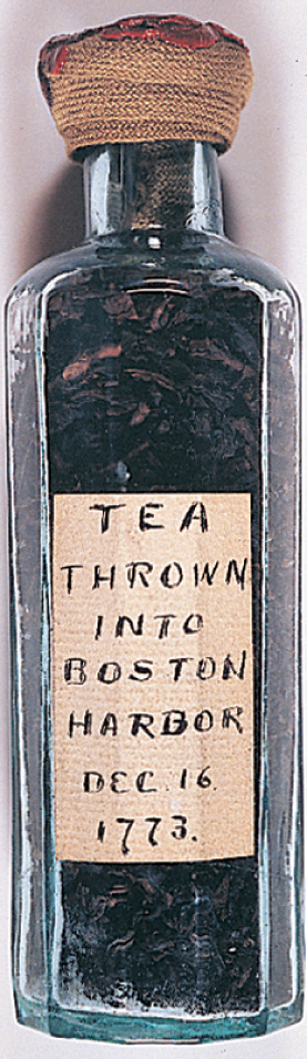 A lable on a bottle reads Tea thrown into Boston Harbor, December 16 1773.