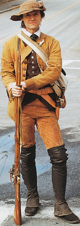 A man in civilian clothes holds a musket.