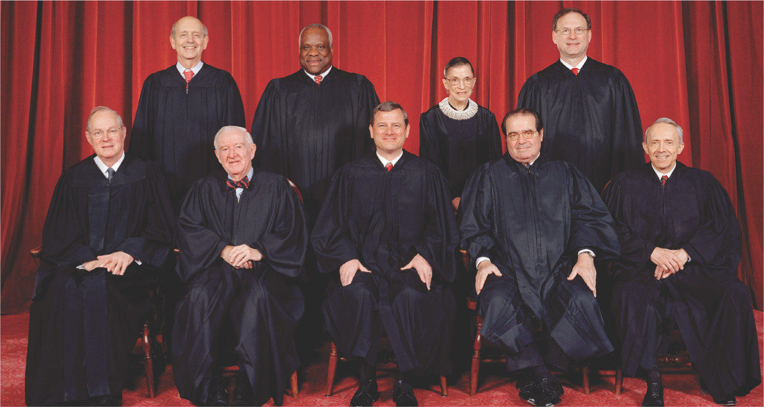 A photo shows
the nine judges of the Supreme Court.