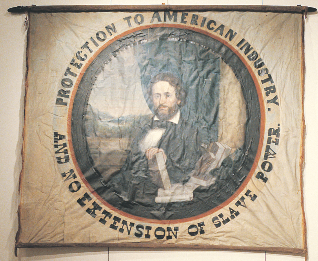 A campaign banner shows a portrait of John C. Fremont and reads Protection to American industry. And no extension of slave power.