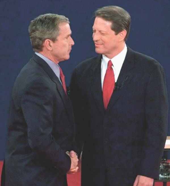 A photo: George W. Bush and Al Gore shake hands at a debate.
