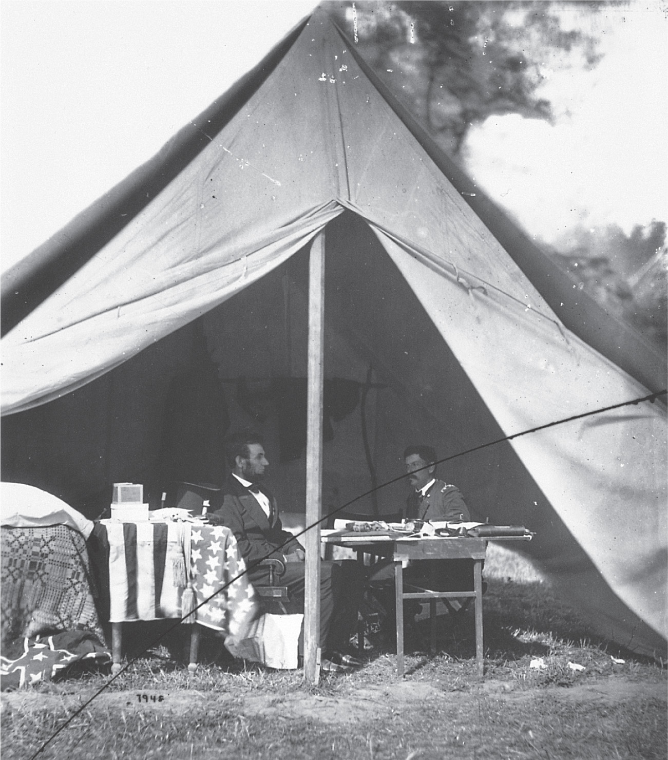 A photo: Lincoln meets with McClellan in a tent.