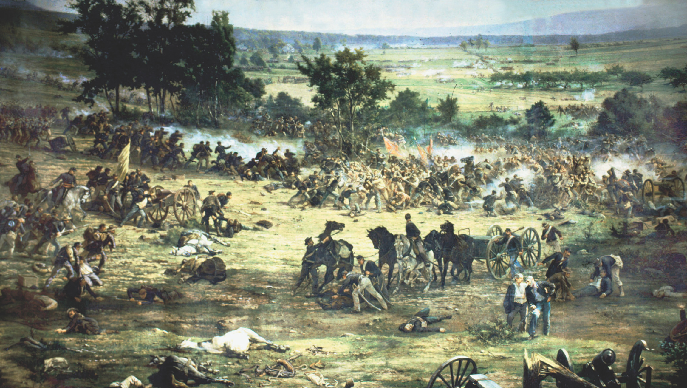 In the painting rifle smoke surrounds the armies as pposing lines fire at each other. Confederates charge past a Union line, toward a cannon. Dead men and horses lie on the battlefield.