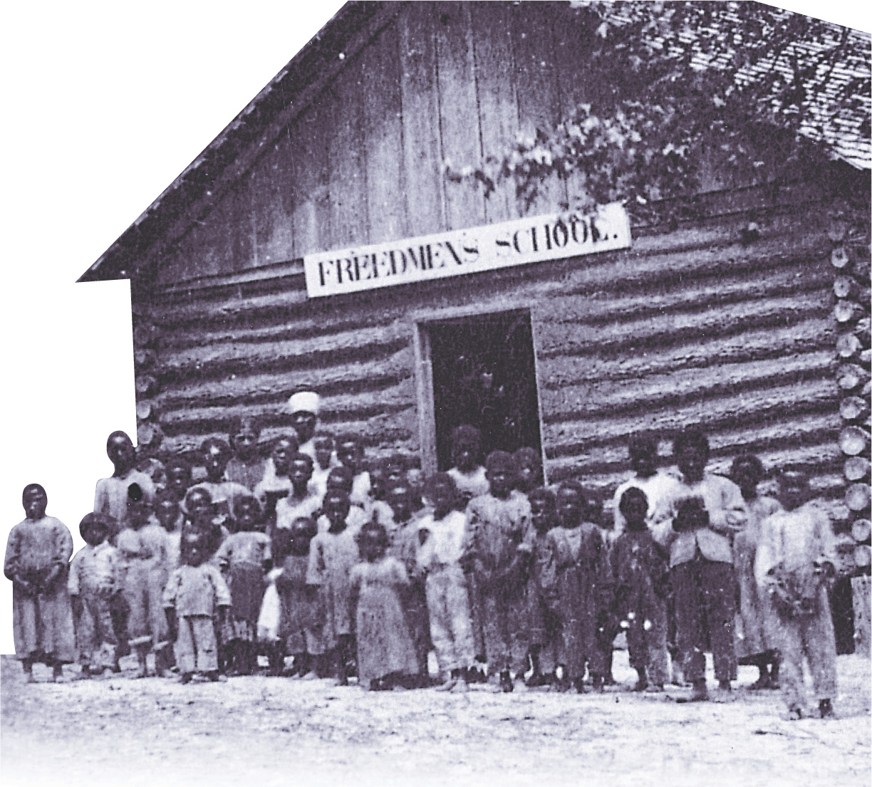 Affrican-American children gather outside a log cabin with a sign that reads Freedman's School. 