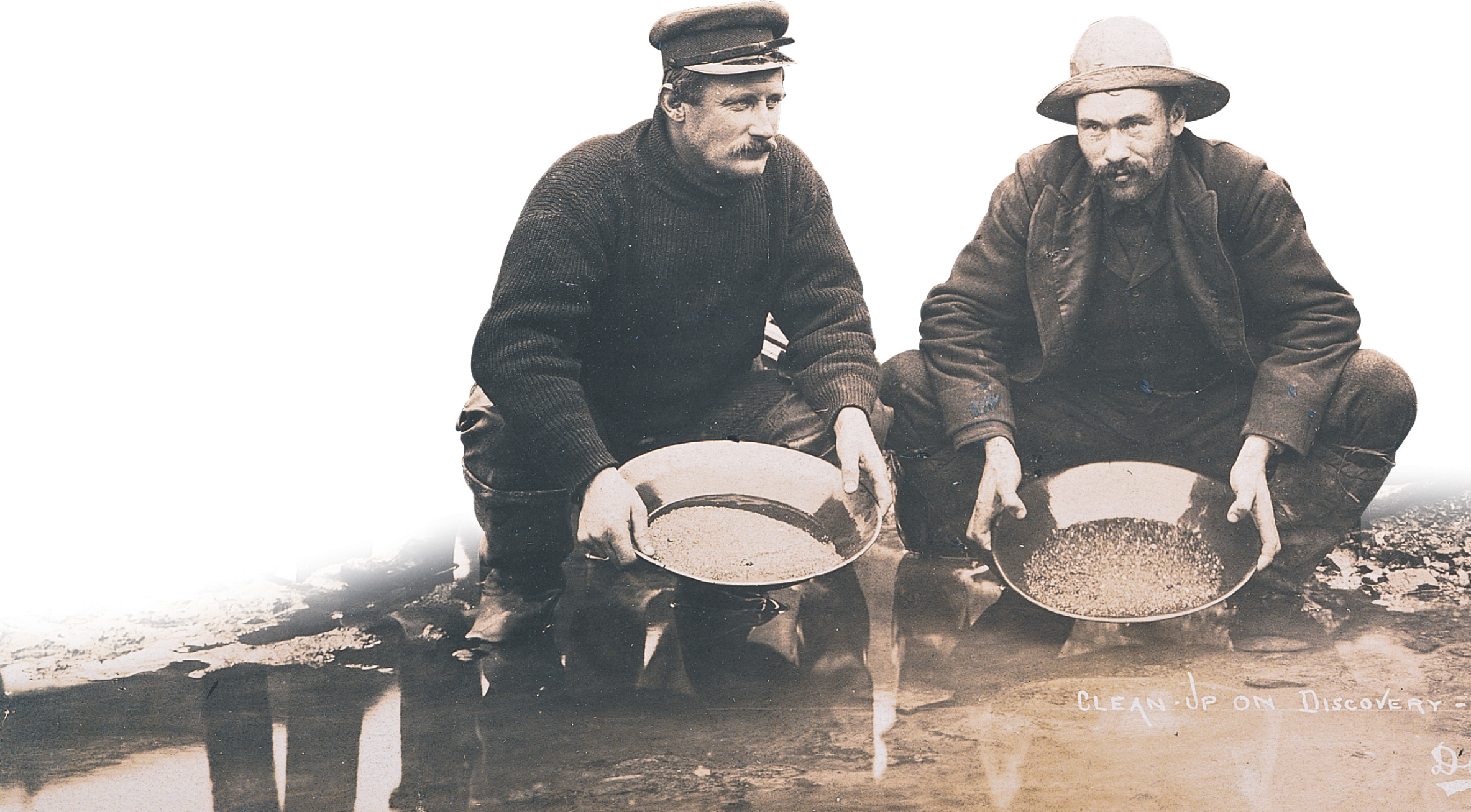 A photo: prospectors pan for gold.