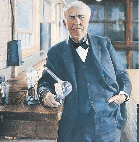 Edison holds a lightbulb.