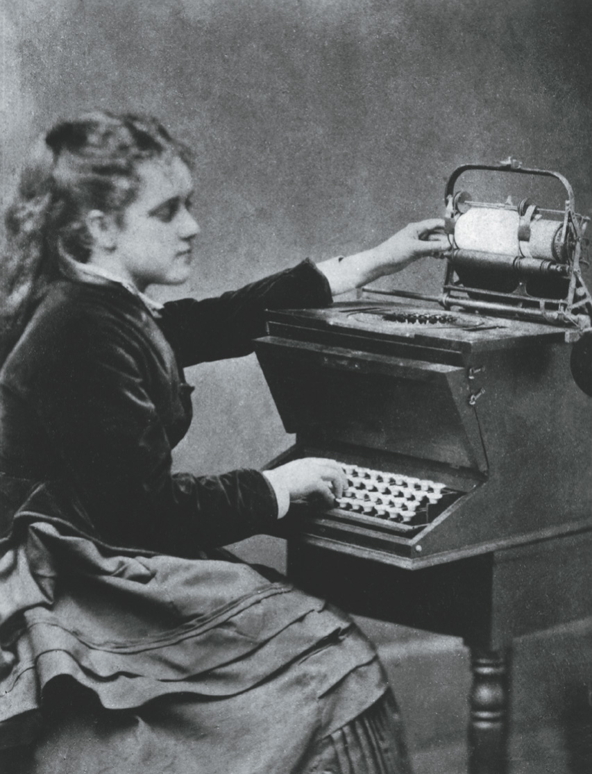 A photo: a woman uses an early typewriter.