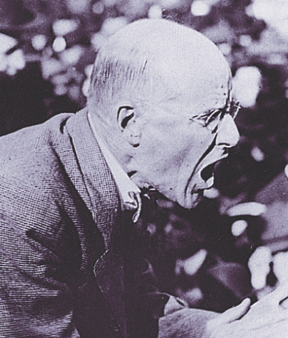 A photo: Eugene Debs yells while making a speech.