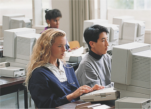 A photo:students use computers.