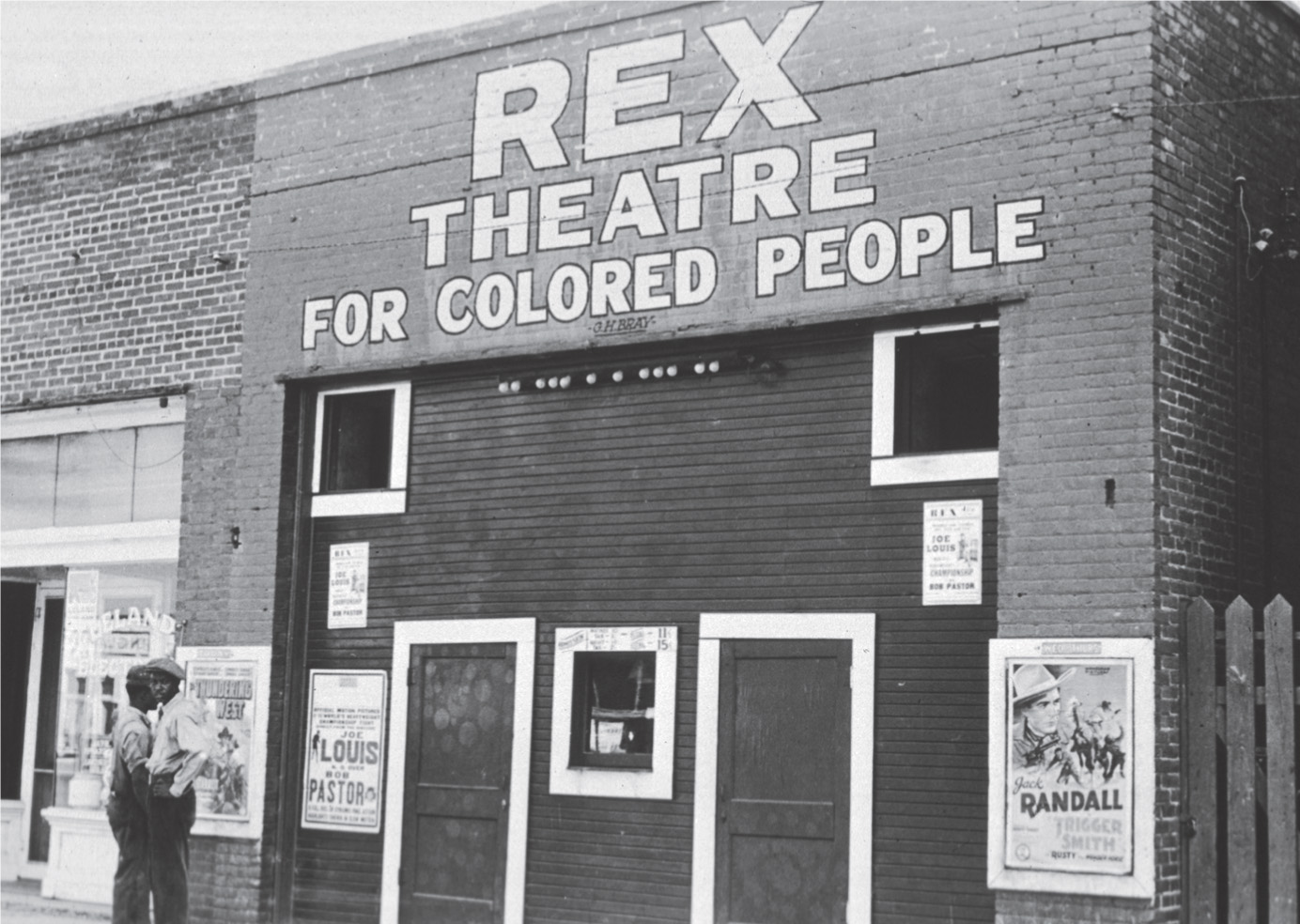 A photo: a movie theatre sign reads Rex Theatre for Colored People.