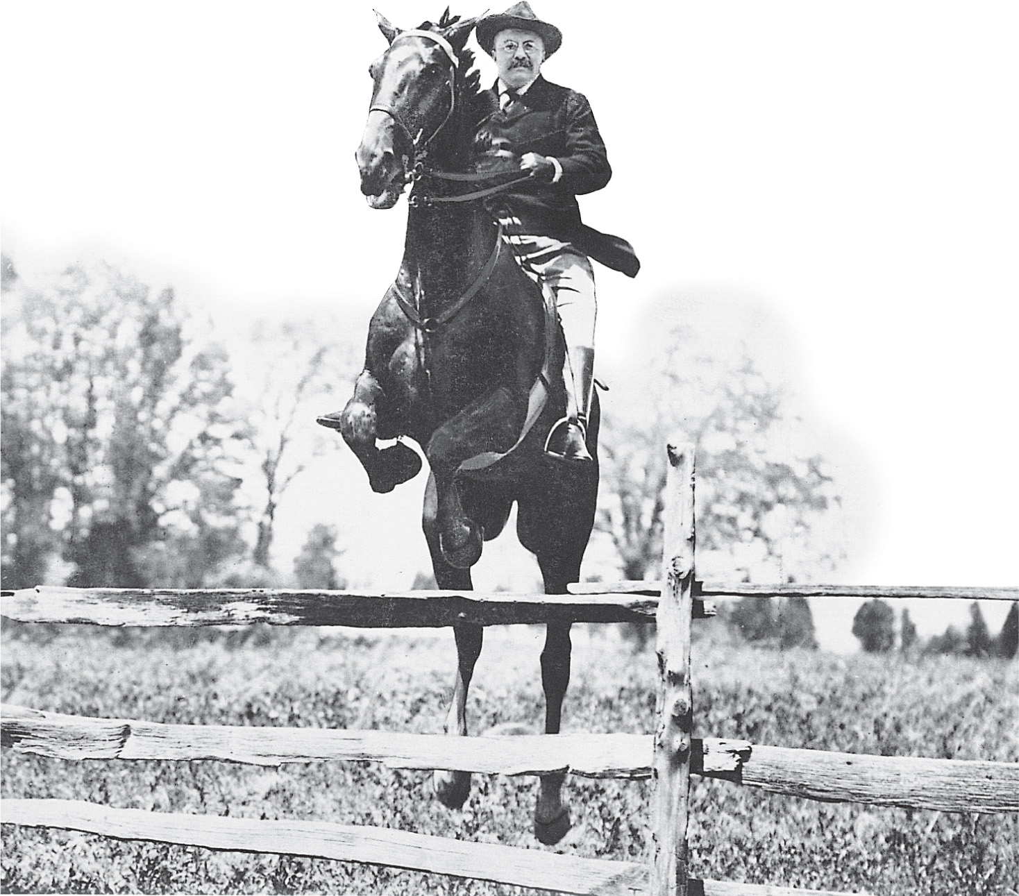 Photo: Teddy Roosevelt jumps his horse over a fence