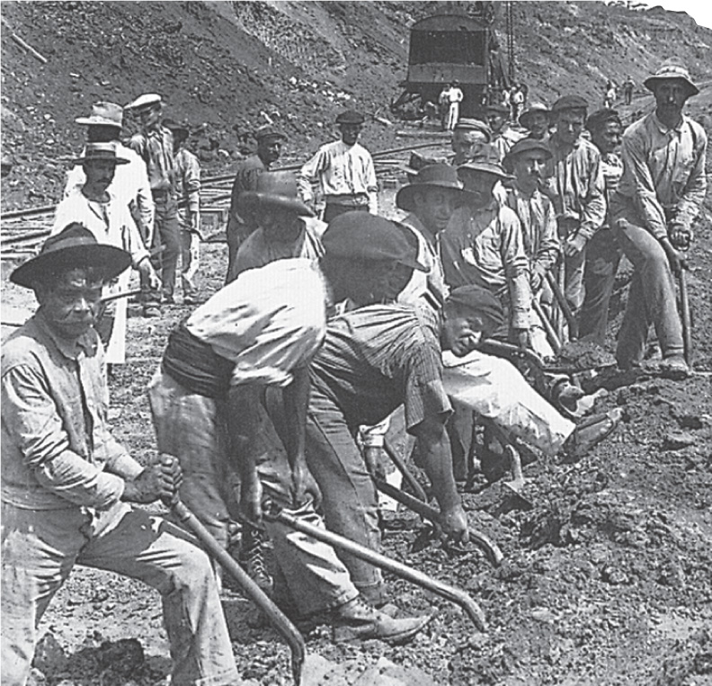 Photo: a dozen workers shovel dirt