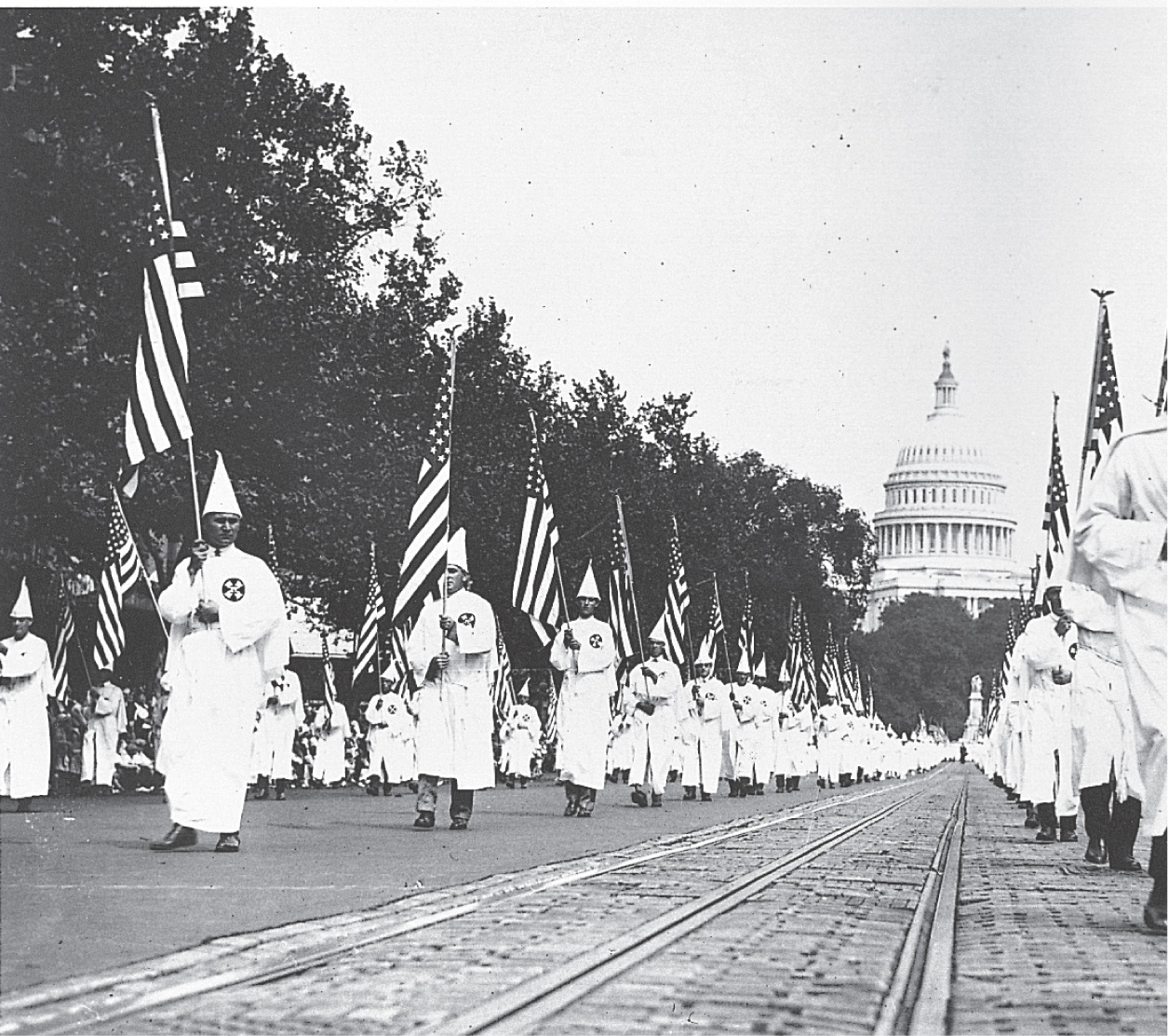 Photo: KKK members wear white robes and conical hats