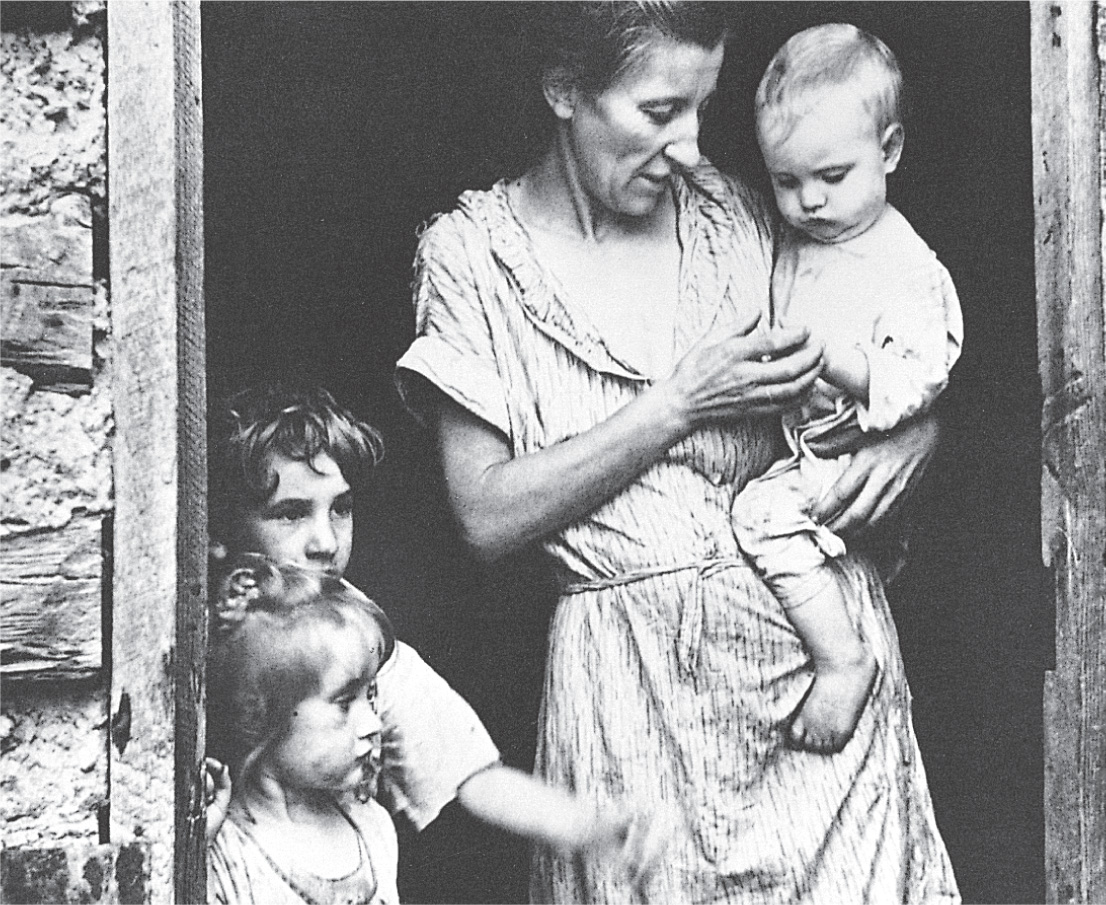 Photo: gaunt woman with 3 children