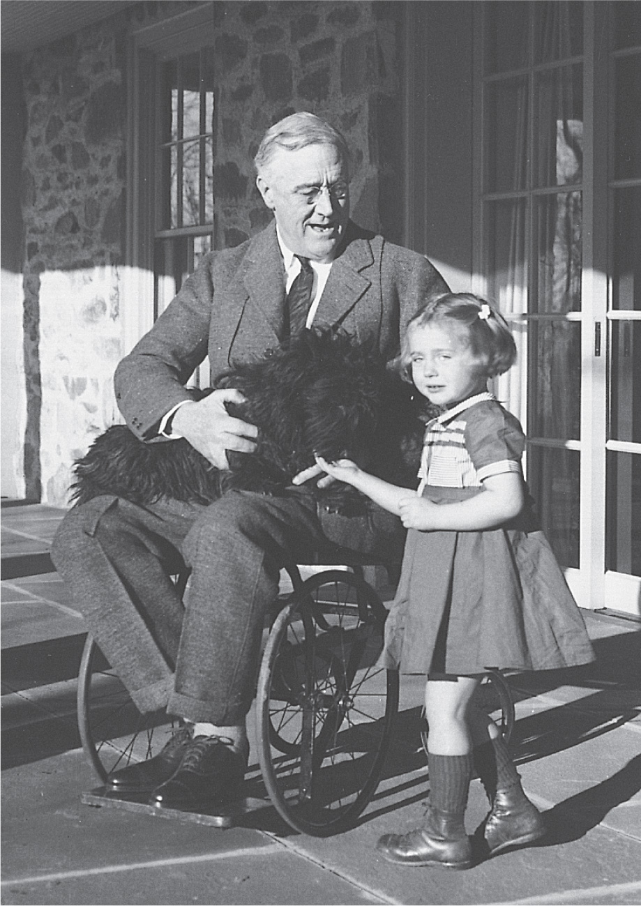 Photo: Franklin D. Roosevelt sits in a wheelchair.