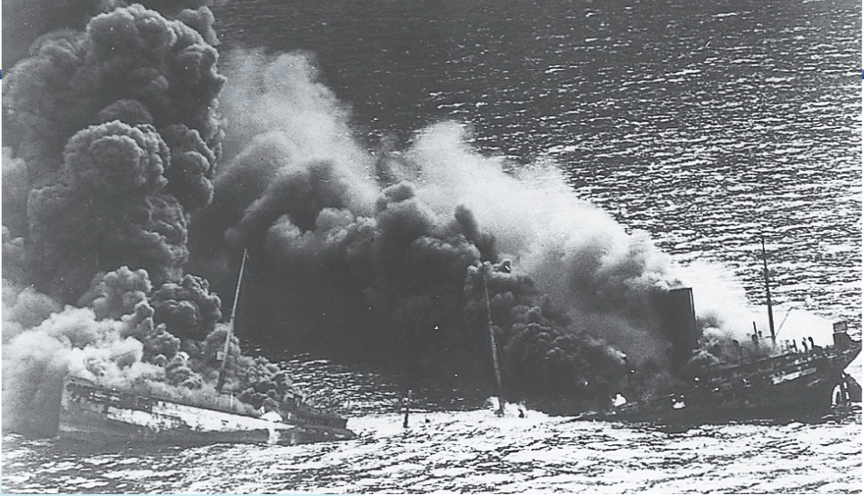 Photo: Smoke billows from a sinking ship