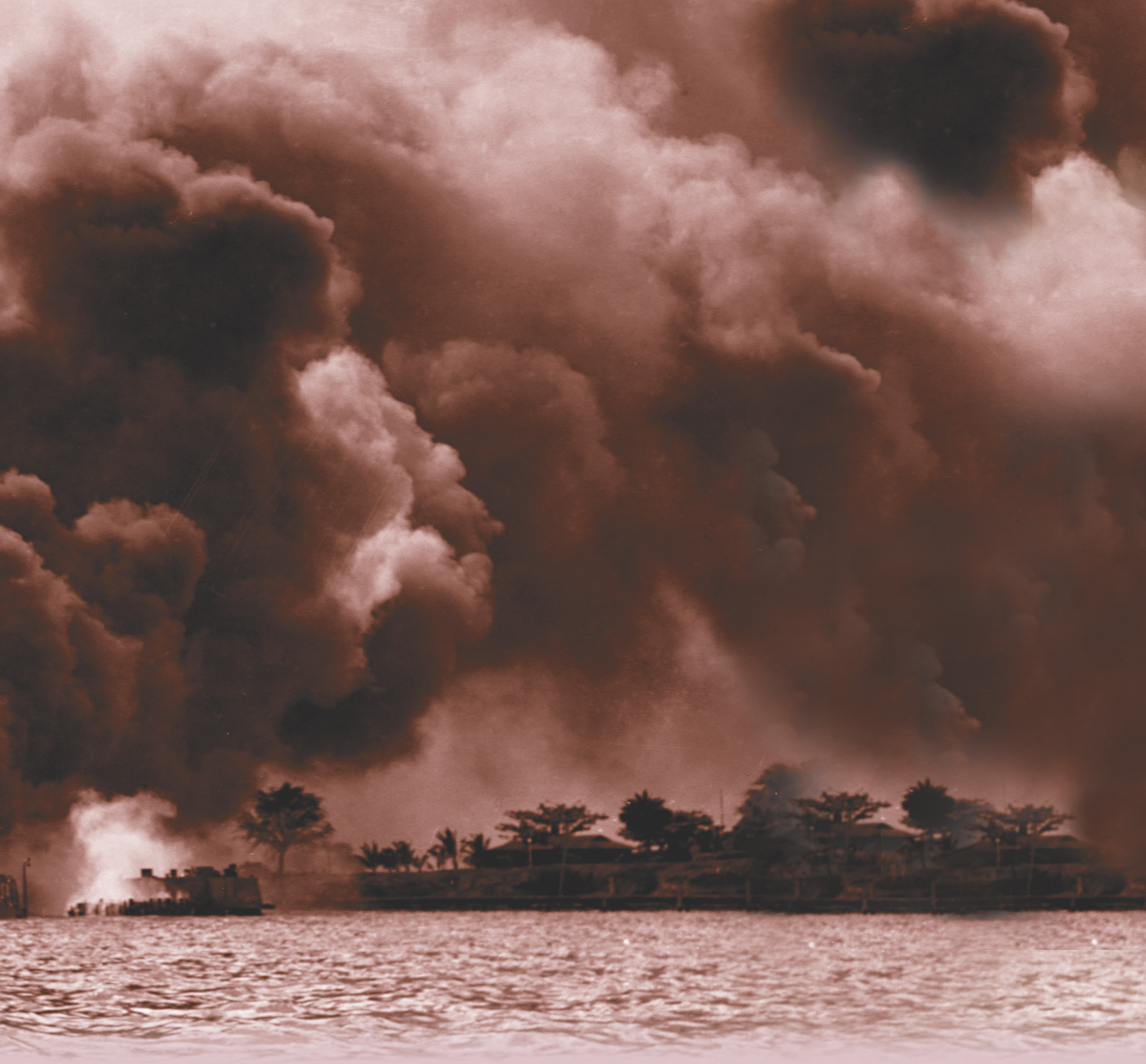 Photo: Smoke billows from burning battleships