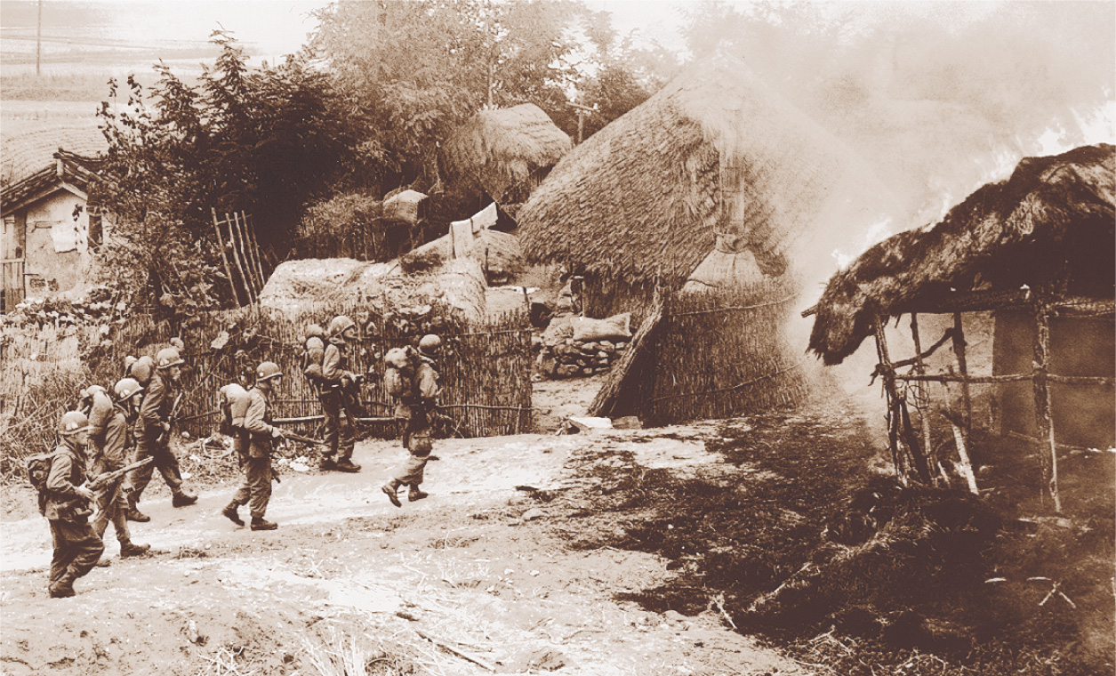 Photo: Paratroopers enter a burning village