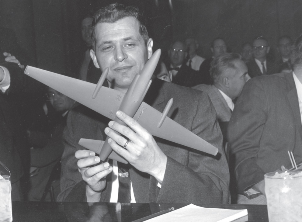 Photo: Francis Gary Powers holds a model airplane