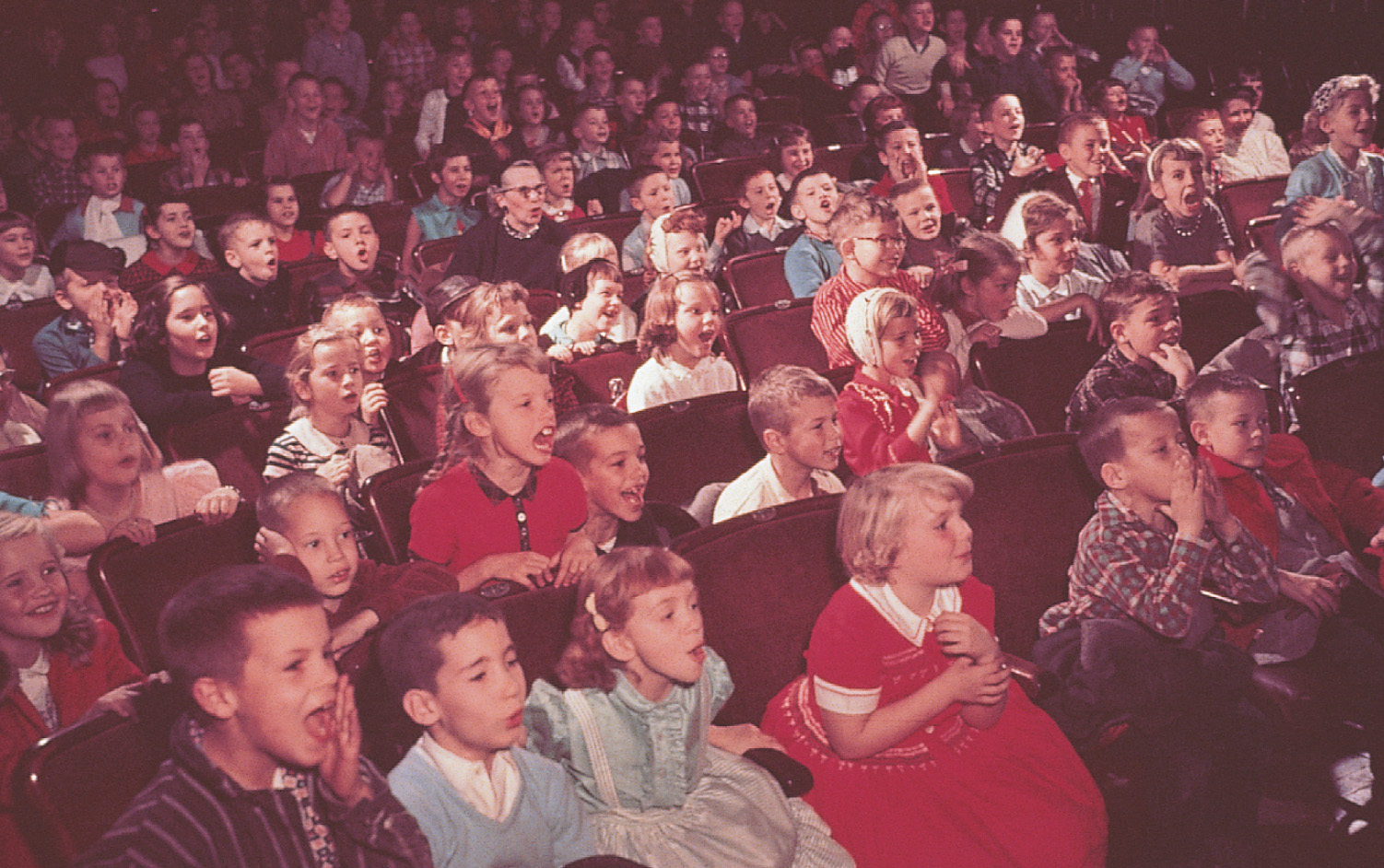Photo: children in an auditorium