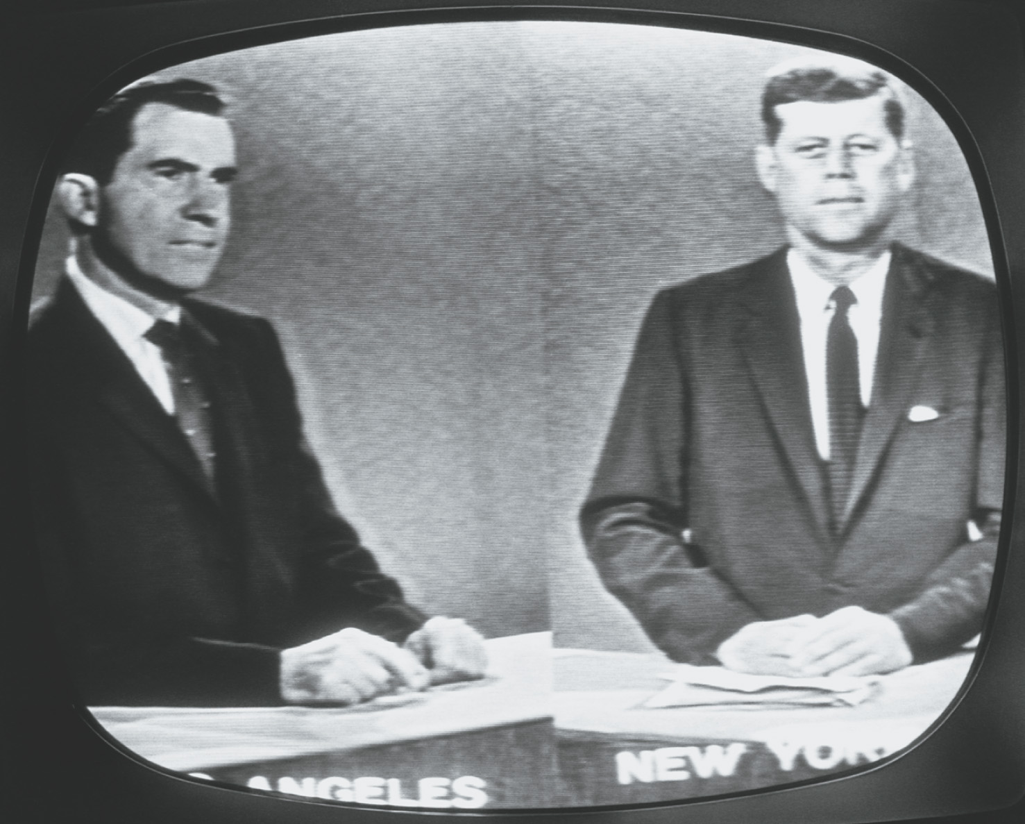 Photo: a black-and-white
TV screen shows Kennedy and Richard Nixon.