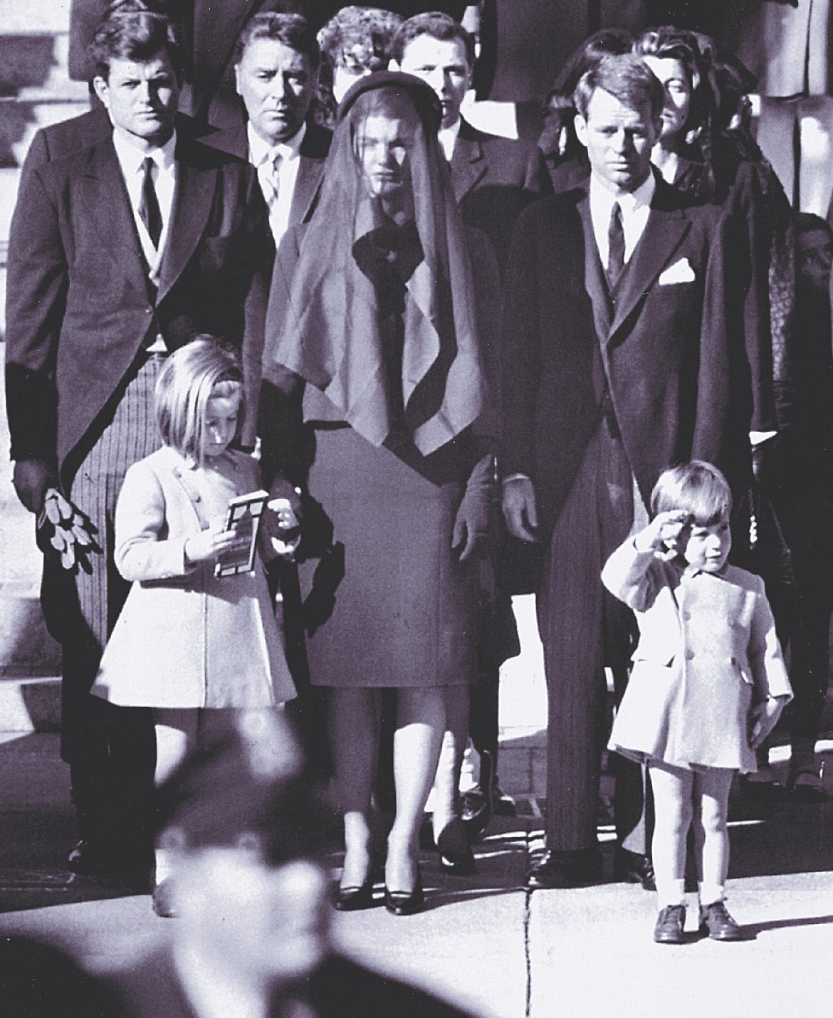 Photo: John Kennedy's family attends the funeral. Three-year-old John Jr. salutes.
