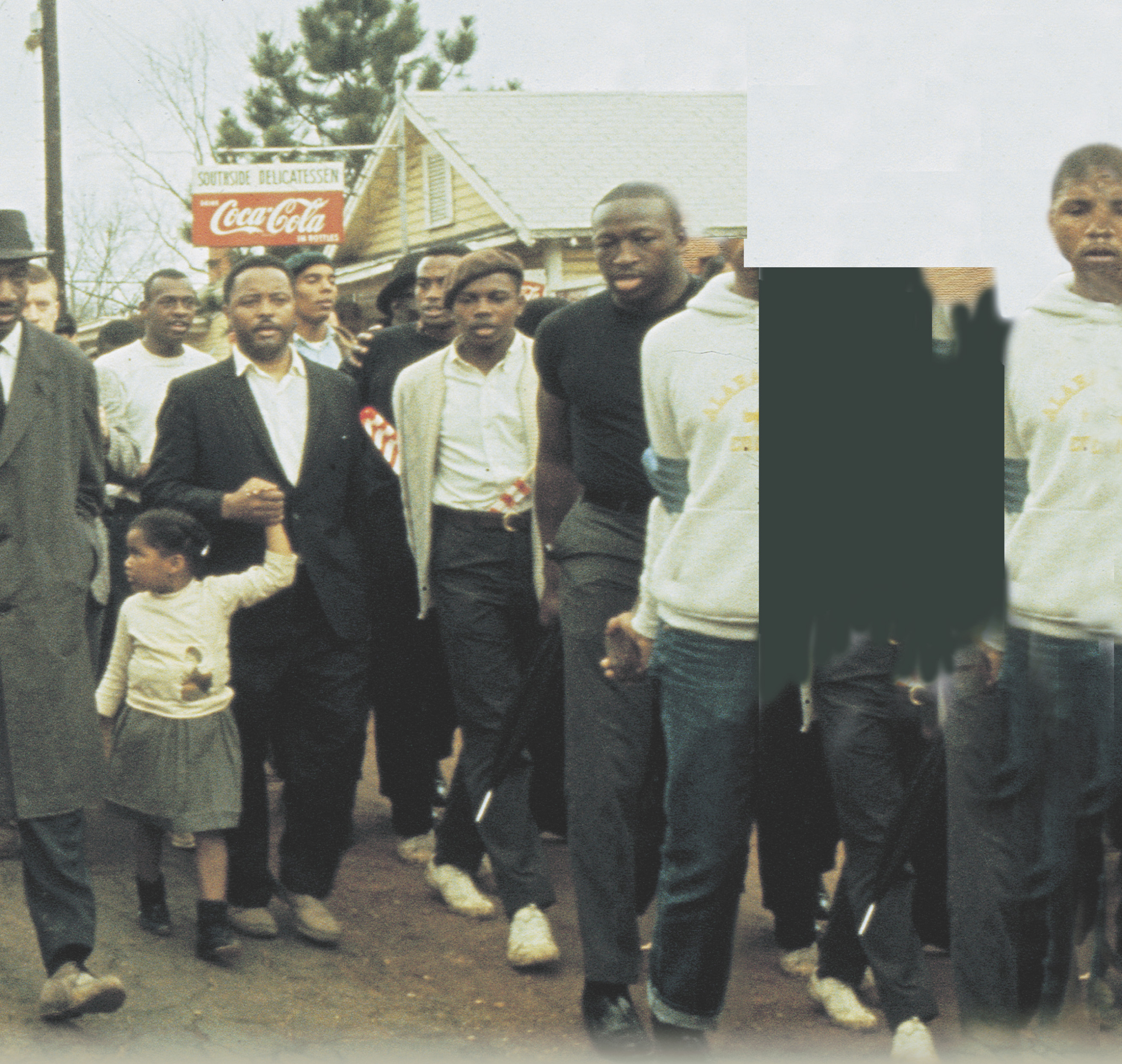 photo: Martin Luther King Jr. leads a crowd of marchers. Some carry American flags. A title: Civil Rights.