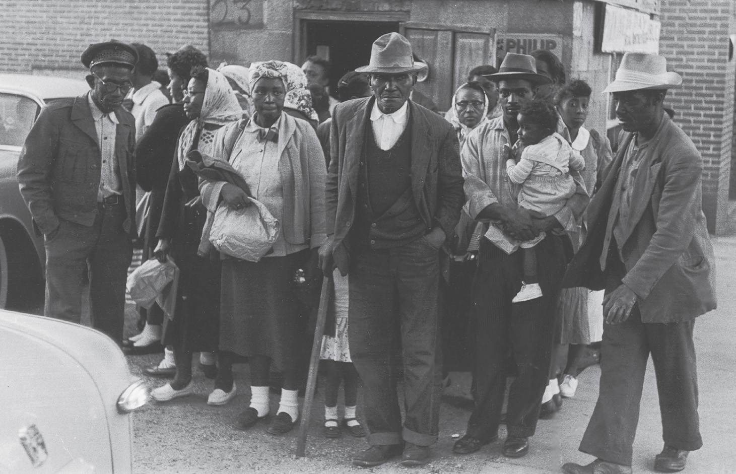 photo: African Americans gather on a street corner.