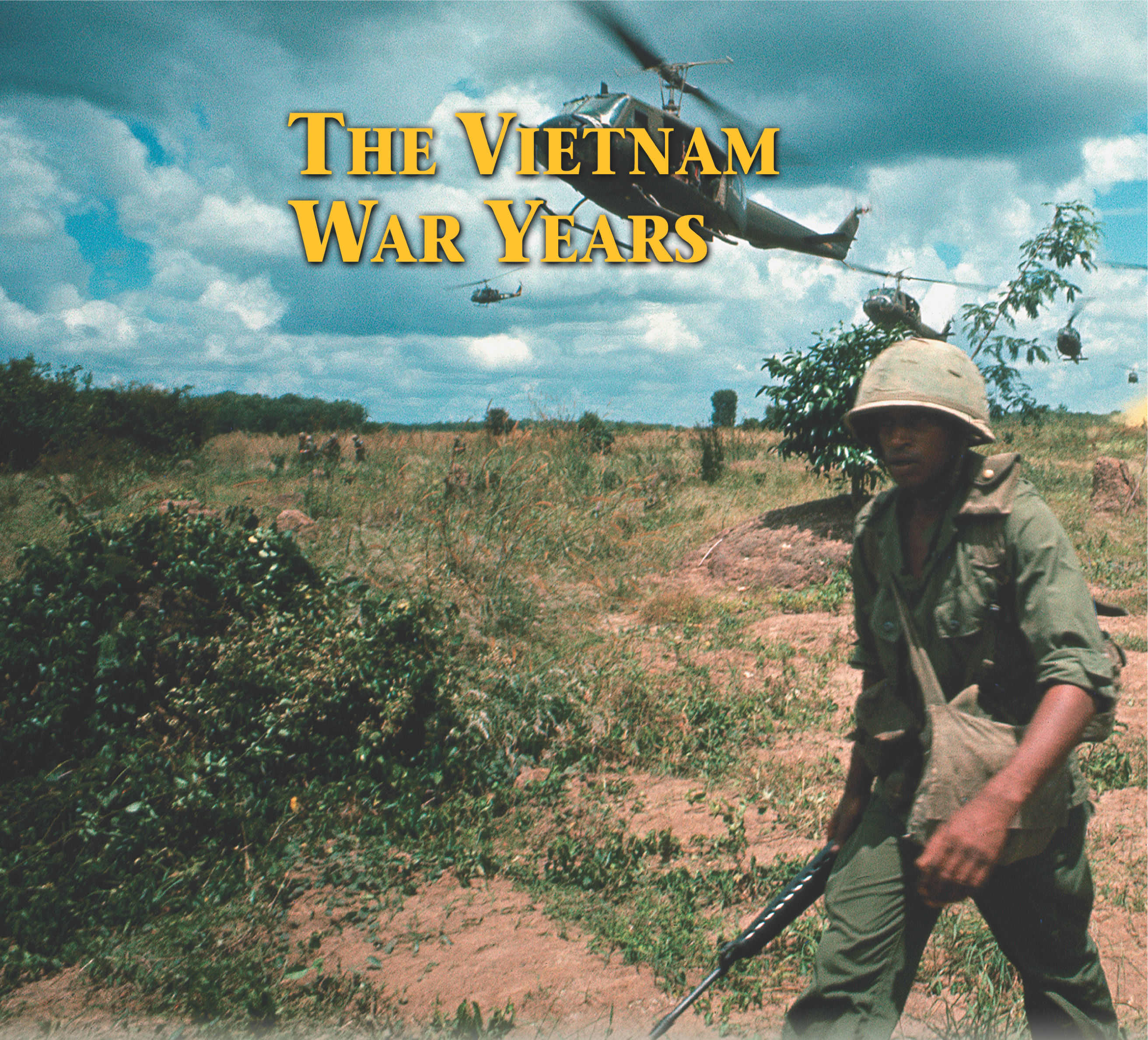 photo: soldiers walk across a field, while helicopters fly low overhead. A title: The Vietnam War Years.