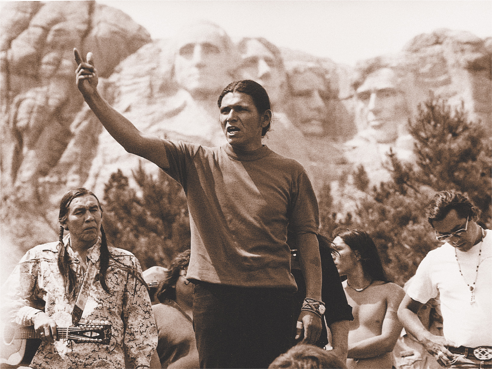 photo: Dennis Banks speaks near Mount Rushmore.