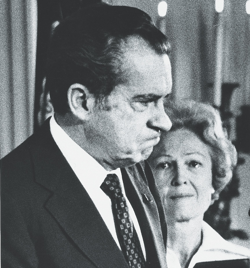photo: Richard Nixon frowns as his wife watches.