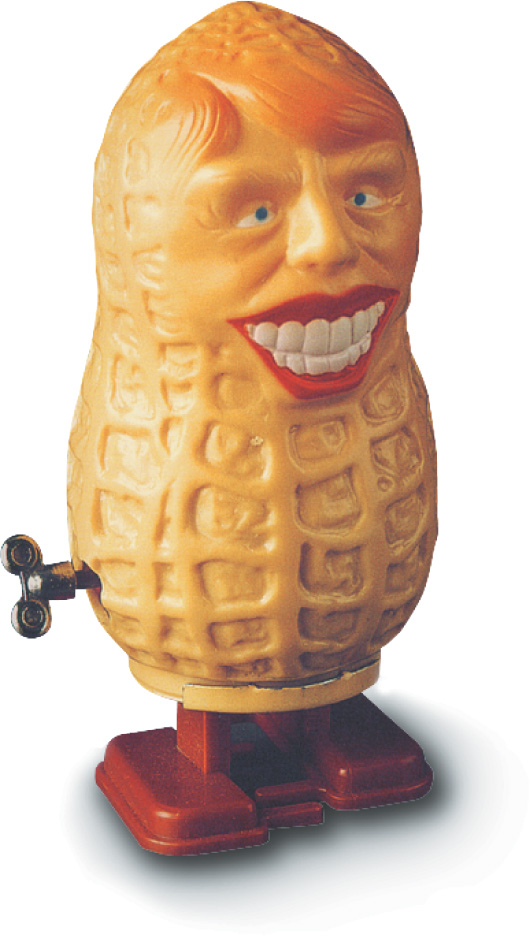 a wind-up toy in the shape of a peanut has a face with toothy grin.