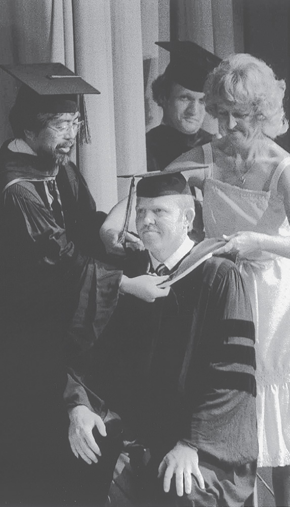 photo: Alan Bakke wears a cap and gown.