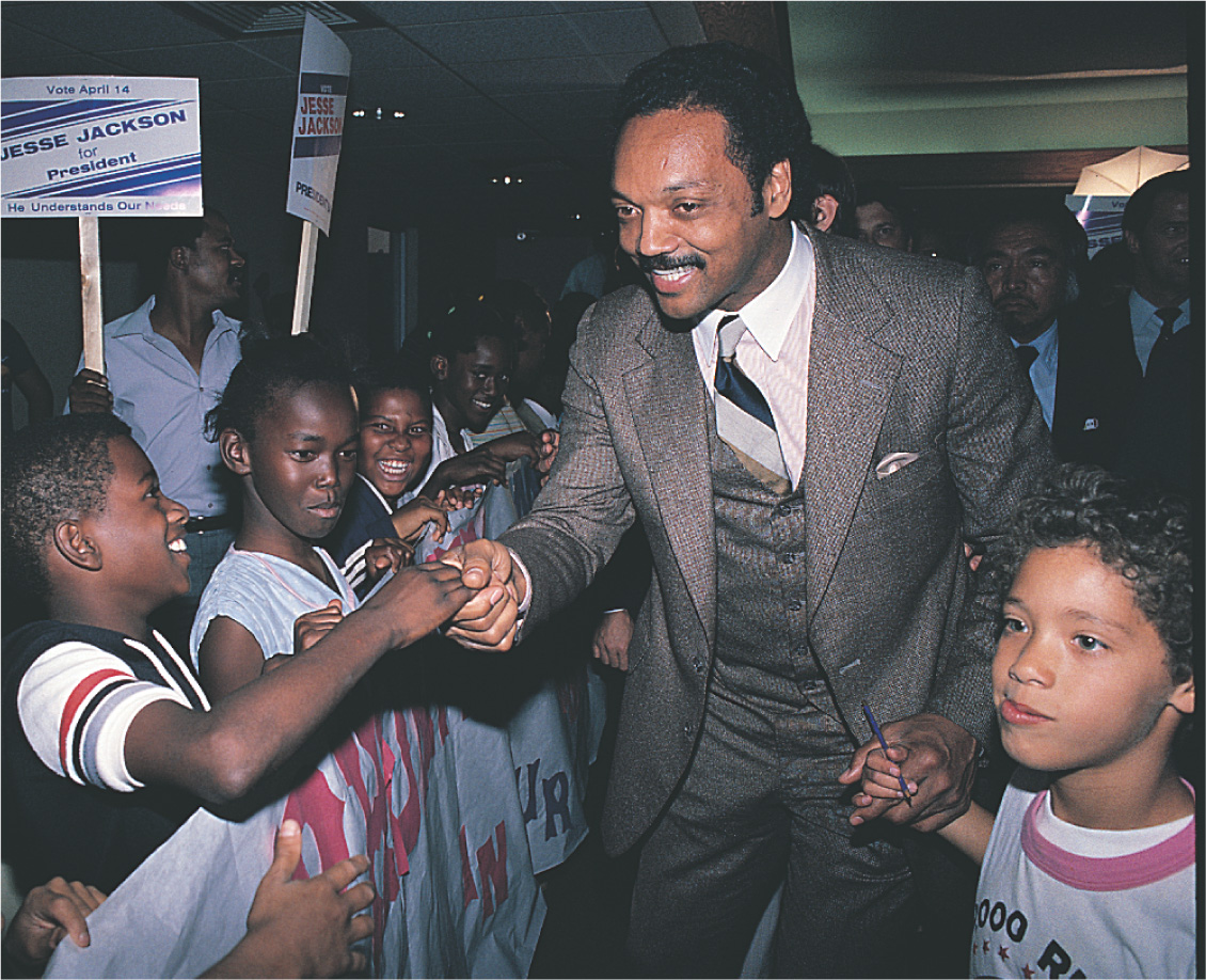 Photo: Jesse Jackson shakes hands with African-American children.