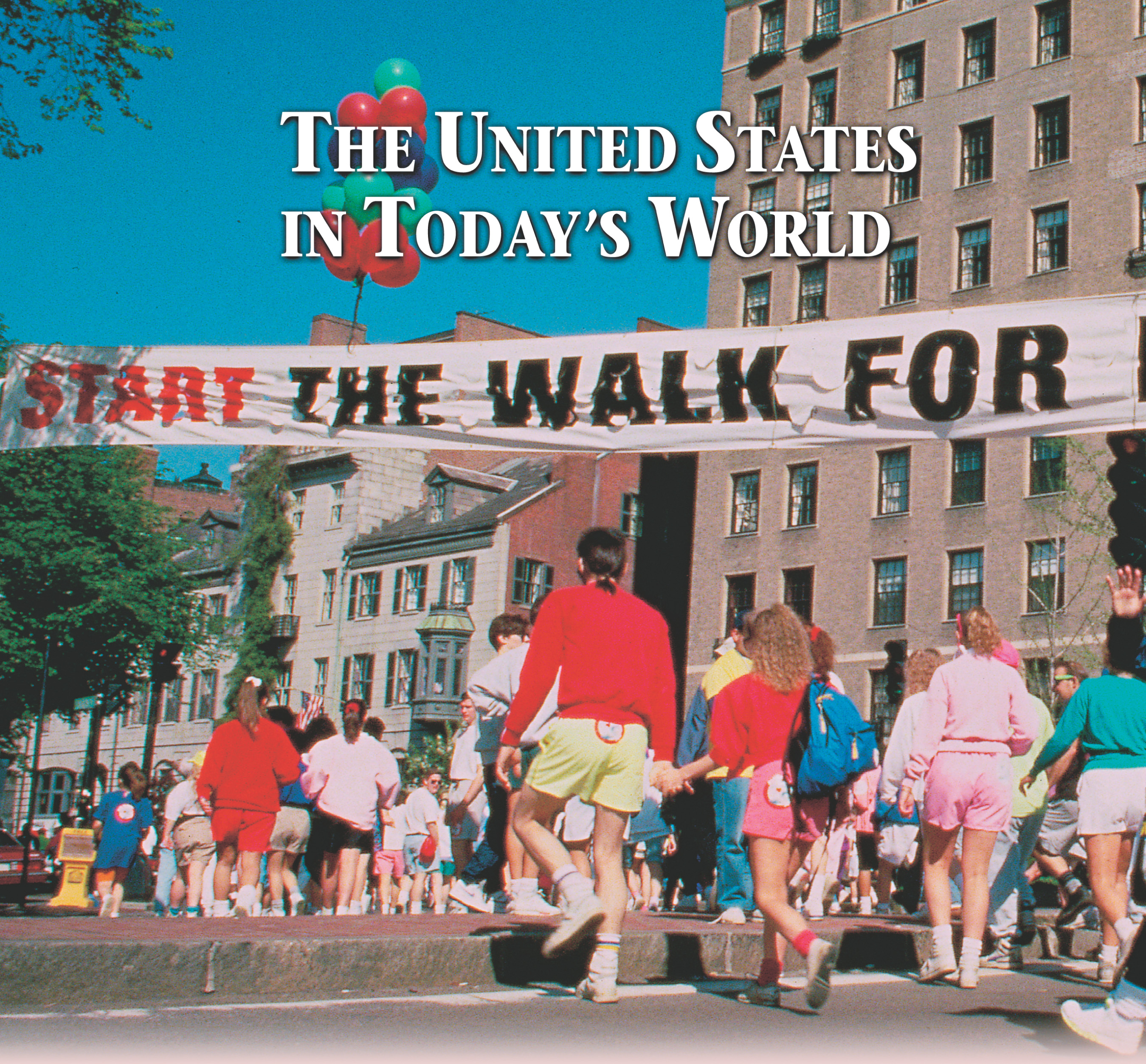 People in shorts and sneakers gather under a banner that reads 'Start: the Walk for Hunger! A title: the United State in Today's World.'