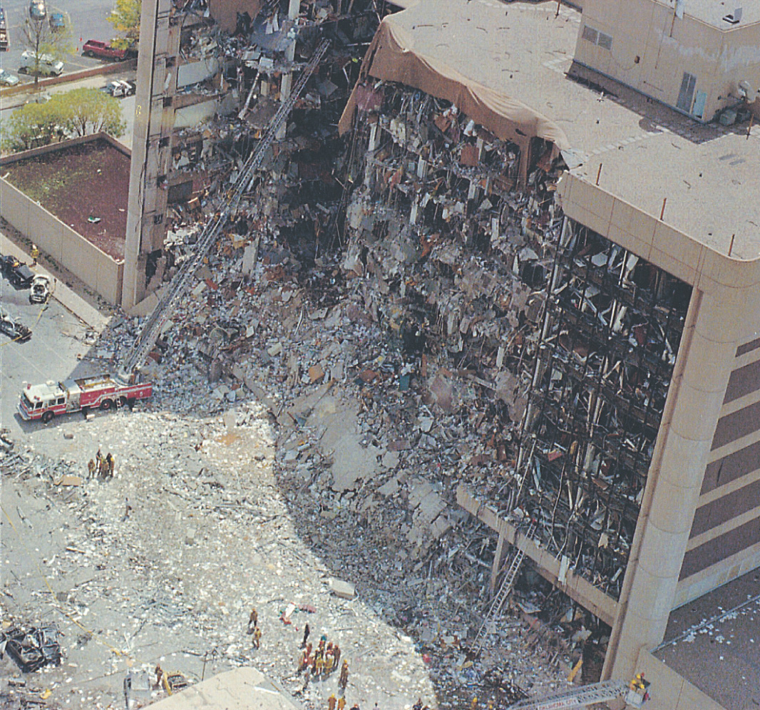 Debris litters the remains of the damaged, high-rise Murrah building.
