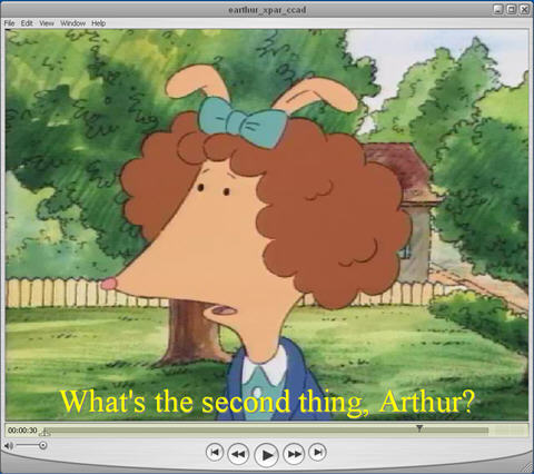 The QuickTime Player showing transparent-background captions over the video region.